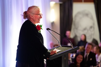 Jacalyn Duffin at podium at 2019 Induction Ceremony
