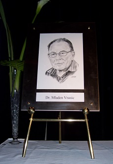 Framed portrait of Mladen Vranic  resting on table easel.