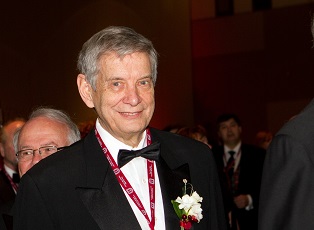 Photo of Alan Ronald walking in procession of Inductees