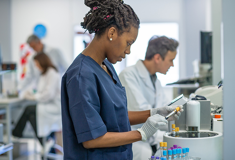 Lab worker holding blood sample