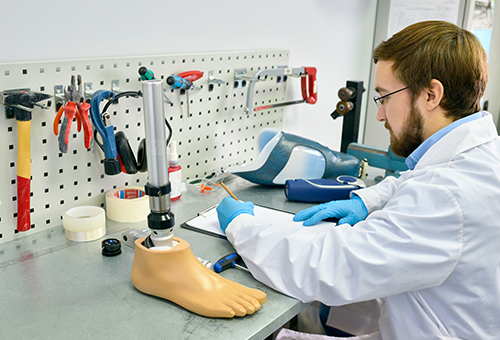 Technician working on artificial leg